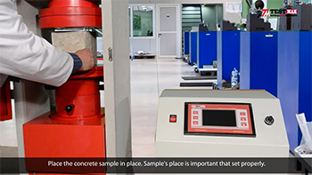 The concrete samples is centered on the compression machine`s lower loading plate